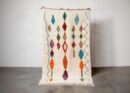 Bunter Berber Teppich mit türkisen und orangefarbenen geometrischen Mustern